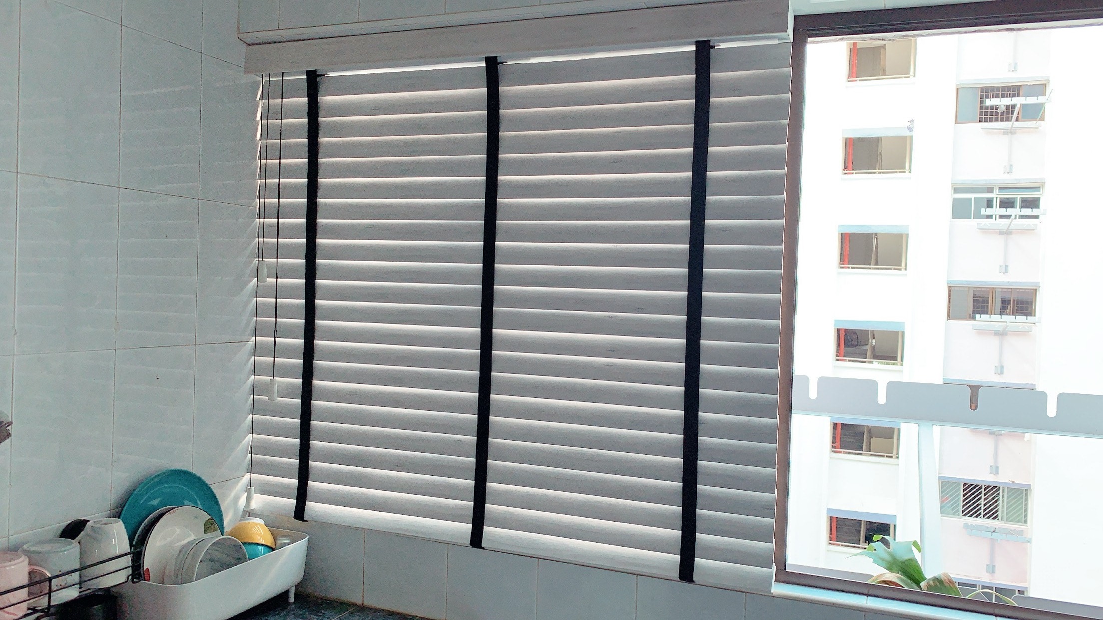 Marble white venetian blinds with black tape
