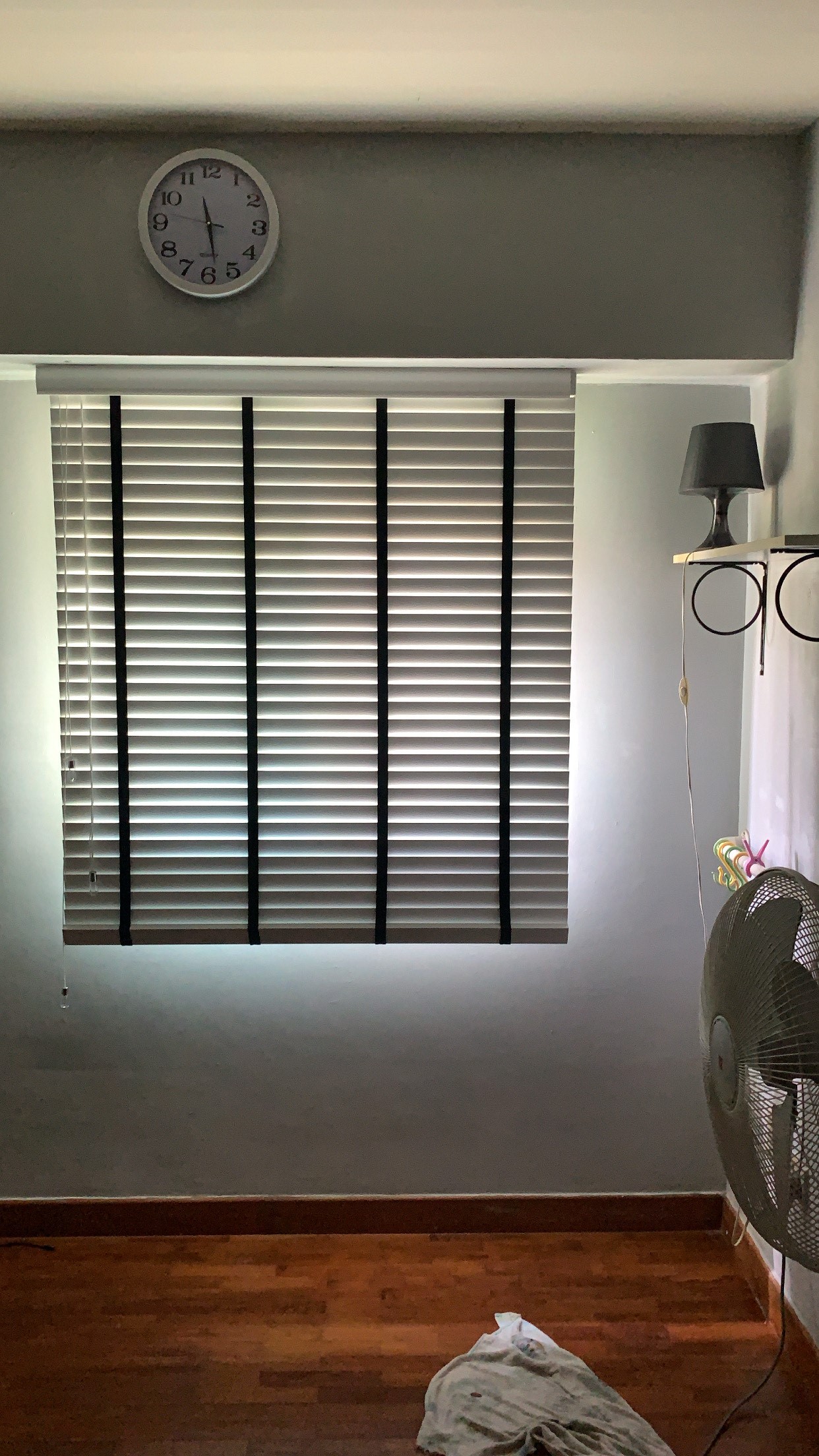 White venetian blinds with black tape