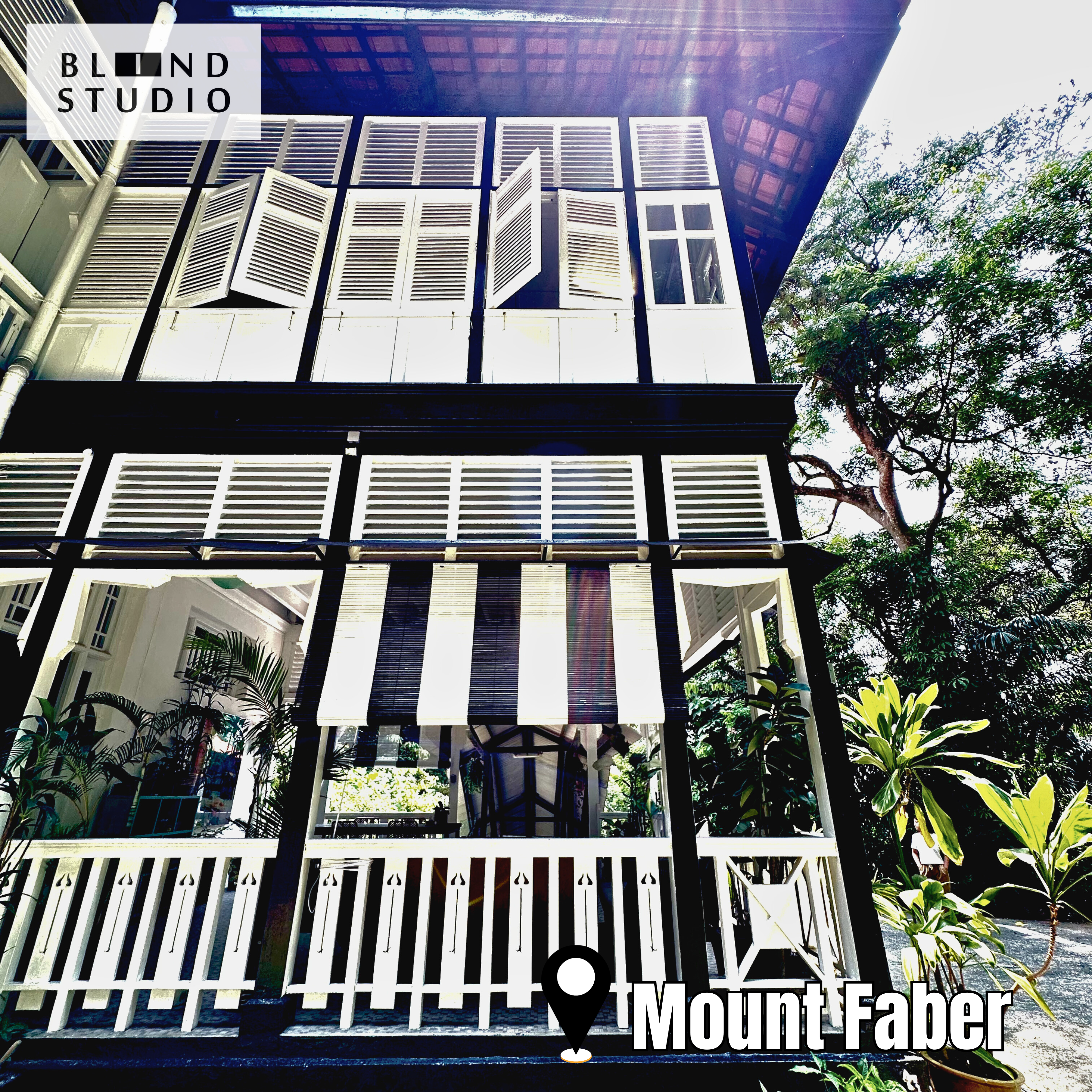 Black and White Bamboo Blinds at the first level of a black and white colonial house