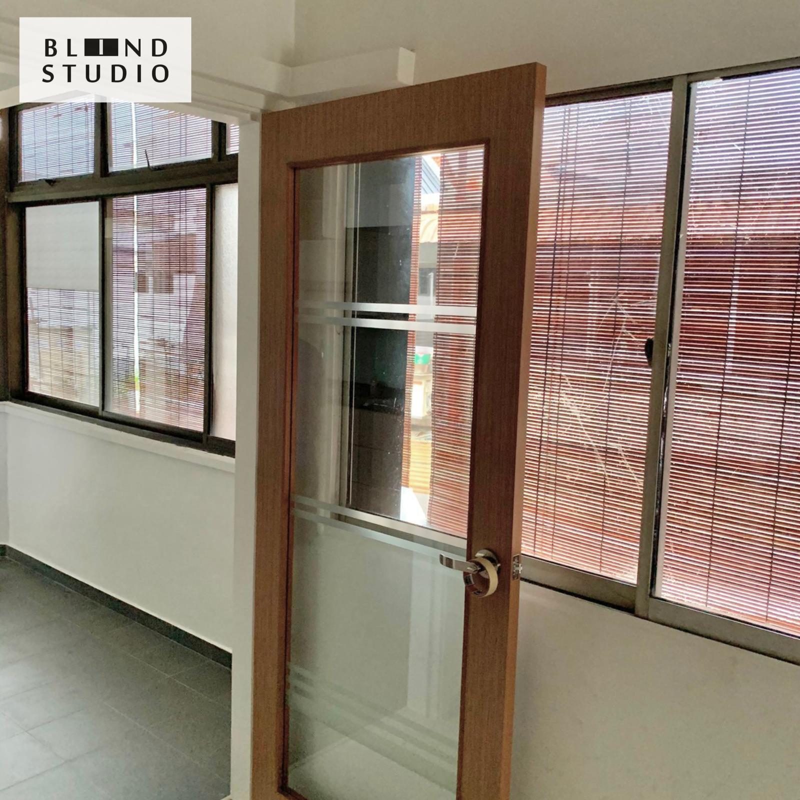 Natural color bamboo blinds shielding the glass window in an office